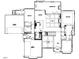 Detailed first floor plan featuring a kitchen, Primary suite, and 2-car garage at 7000 North Ridge Dr, Raleigh, NC 27615