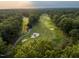 Scenic aerial view of a well-manicured golf course surrounded by lush greenery at 7000 North Ridge Dr, Raleigh, NC 27615