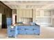 Unfinished kitchen featuring custom cabinets and a large island, ready for appliances at 7000 North Ridge Dr, Raleigh, NC 27615