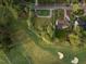 Aerial view of a lush lot on the golf course in a desirable neighborhood at 7000 North Ridge Dr, Raleigh, NC 27615