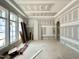 Unfinished room featuring large windows and an arched entryway, awaiting customization at 7000 North Ridge Dr, Raleigh, NC 27615