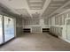 Bright living room with sliding glass doors and built in shelving at 7000 North Ridge Dr, Raleigh, NC 27615