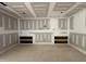 Large unfinished living room featuring custom built-in shelving and entertainment area at 7000 North Ridge Dr, Raleigh, NC 27615