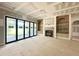 Bright living room with a fireplace and built-in shelving, awaiting your personal touch at 7000 North Ridge Dr, Raleigh, NC 27615