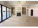 Spacious living room with built-in shelving and a fireplace, ready for customization at 7000 North Ridge Dr, Raleigh, NC 27615