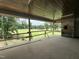 Covered porch with views of the golf course at 7000 North Ridge Dr, Raleigh, NC 27615