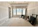 Bright room with large windows showcasing natural outdoor views, and construction materials at 7000 North Ridge Dr, Raleigh, NC 27615