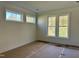 Well-lit bedroom with multiple windows at 90 Lambert Ln, Fuquay Varina, NC 27526