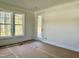 Bedroom with door to patio and large windows at 90 Lambert Ln, Fuquay Varina, NC 27526