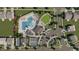 Aerial view showing pool, tennis courts, and parking at 125 S Stone Mill Trl # 241, Clayton, NC 27520