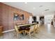 Dining room with wood-look floors and accent wall at 125 S Stone Mill Trl # 241, Clayton, NC 27520