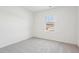 Simple bedroom with carpeted floor and a window at 232 Babbling Brook Dr, Clayton, NC 27520