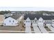 An aerial view of townhomes showcasing the community layout and surrounding landscape at 28 Nettle Ln # 235, Clayton, NC 27520