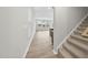 Inviting entryway showcasing hardwood floors, stairs, and abundant natural light at 28 Nettle Ln # 235, Clayton, NC 27520