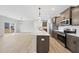 Bright kitchen featuring stainless steel appliances, an island, and sleek countertops at 28 Nettle Ln # 235, Clayton, NC 27520