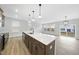 Large kitchen island with seating, pendant lighting, and stainless steel appliances at 28 Nettle Ln # 235, Clayton, NC 27520