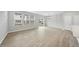 Bright and spacious living room with lots of windows, hardwood floors, and a chandelier at 28 Nettle Ln # 235, Clayton, NC 27520