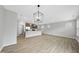 Open living space features a large kitchen island, natural lighting and neutral wall paint at 28 Nettle Ln # 235, Clayton, NC 27520