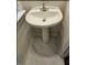 Modern bathroom vanity featuring a sleek pedestal sink and stylish marble-look flooring at 330 Gilman Ln # 106, Raleigh, NC 27610