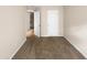 Cozy bedroom showcasing neutral carpeting, a closet, and open doorway to the next room at 330 Gilman Ln # 106, Raleigh, NC 27610
