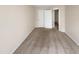Inviting bedroom with neutral carpeting, closet space, and a view into the next room at 330 Gilman Ln # 106, Raleigh, NC 27610
