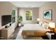 Staged bedroom offers natural light, neutral walls, and cozy carpet at 330 Gilman Ln # 106, Raleigh, NC 27610