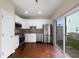 Modern kitchen features stainless steel appliances, white cabinets, and access to the yard at 330 Gilman Ln # 106, Raleigh, NC 27610