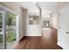 Open-concept living space with wood floors and sliding glass door to backyard at 330 Gilman Ln # 106, Raleigh, NC 27610