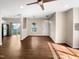 Spacious living room with hardwood floors, neutral paint, and access to the kitchen and outdoor area at 330 Gilman Ln # 106, Raleigh, NC 27610