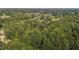 Aerial view showing home, expansive lot, and pond at 118 W Silver Belle Dr, Zebulon, NC 27597