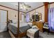 Main bedroom with a post bed and ceiling fan at 118 W Silver Belle Dr, Zebulon, NC 27597