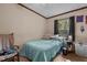 Bedroom with full-size bed and window at 118 W Silver Belle Dr, Zebulon, NC 27597