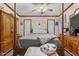 Bedroom with wooden dresser and large bed at 118 W Silver Belle Dr, Zebulon, NC 27597