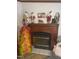 Cozy fireplace with holiday decorations at 118 W Silver Belle Dr, Zebulon, NC 27597