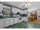 White kitchen with ample cabinetry and appliances at 118 W Silver Belle Dr, Zebulon, NC 27597