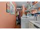 Laundry room with washer, dryer, and shelving at 118 W Silver Belle Dr, Zebulon, NC 27597