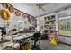 Playroom with built-in shelving, window seat, and toys at 118 W Silver Belle Dr, Zebulon, NC 27597