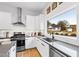 Modern kitchen with stainless steel appliances and a large window at 1511 Malta Ave, Raleigh, NC 27610
