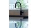 Modern kitchen sink with a sleek black gooseneck faucet at 1511 Malta Ave, Raleigh, NC 27610