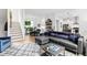 Spacious open-concept living room with hardwood floors, stylish decor, and ample seating at 1511 Malta Ave, Raleigh, NC 27610
