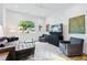 Well-lit living room with hardwood floors, comfortable seating, and contemporary decor at 1511 Malta Ave, Raleigh, NC 27610