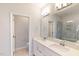 Bathroom with double sink vanity, large mirror and glass enclosed shower with seat at 3181 Mission Olive Pl # 346, New Hill, NC 27562