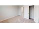 Well-lit carpeted bedroom showcases an open closet with shelving and an attached room at 3181 Mission Olive Pl # 346, New Hill, NC 27562
