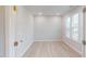 Well-lit bedroom featuring hardwood floors, a window with blinds, and ample space at 3181 Mission Olive Pl # 346, New Hill, NC 27562