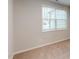 The bedroom is bathed in light from a single window at 3181 Mission Olive Pl # 346, New Hill, NC 27562