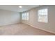 Spacious carpeted bedroom with large windows providing plenty of natural light at 3181 Mission Olive Pl # 346, New Hill, NC 27562