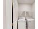 Bright laundry room with a white washer and dryer, wire shelving, and a conveniently located electrical outlet at 3181 Mission Olive Pl # 346, New Hill, NC 27562
