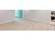 Open living space with wood floors, patio access, and modern kitchen view at 3181 Mission Olive Pl # 346, New Hill, NC 27562