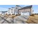 Rear view of townhomes featuring garages and driveways at 3181 Mission Olive Pl # 346, New Hill, NC 27562