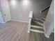 Modern staircase with hardwood treads and white risers at 3181 Mission Olive Pl # 346, New Hill, NC 27562